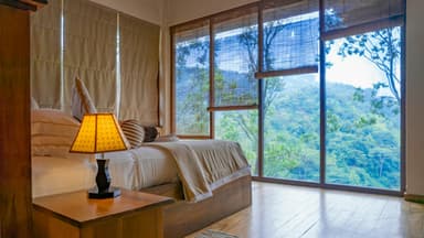 Sample guest suite overlooking a green hillside